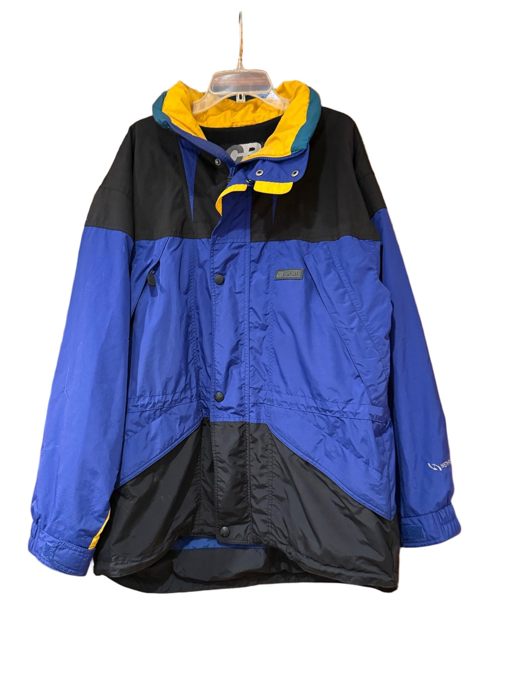 Vintage CB Sport Men's Blue and Black Insulated Ski Jacket with Yellow Hood Trim